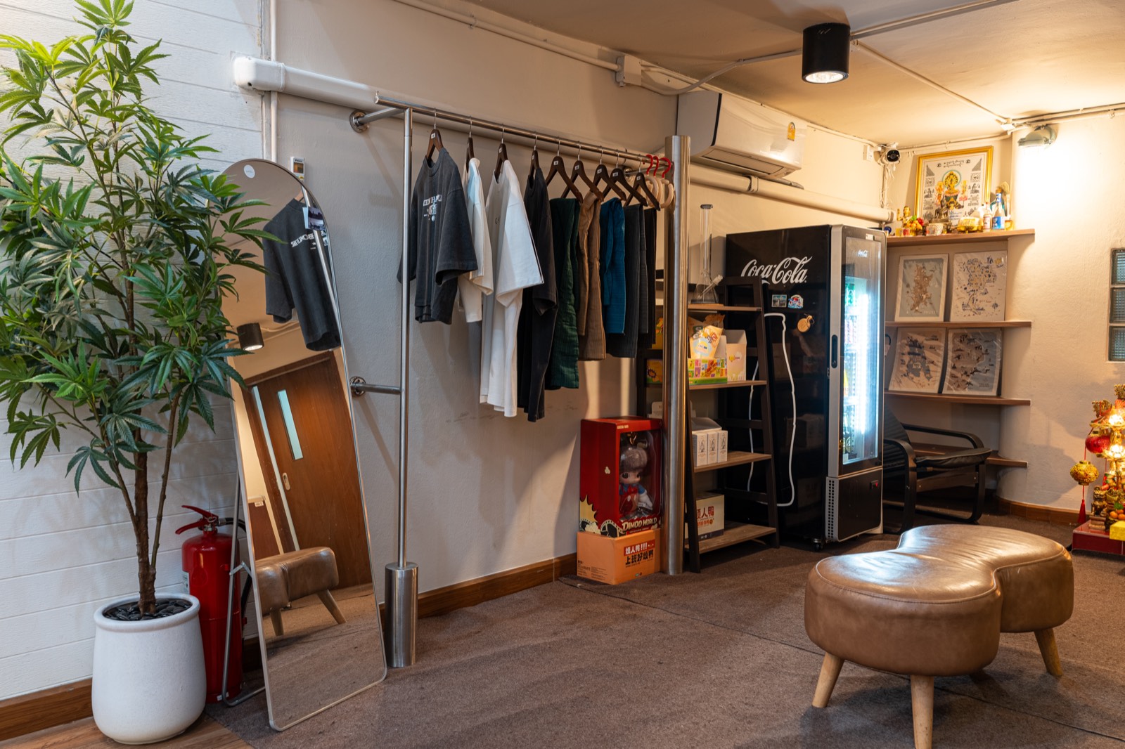 Interior view of clothing rack and lounge seating